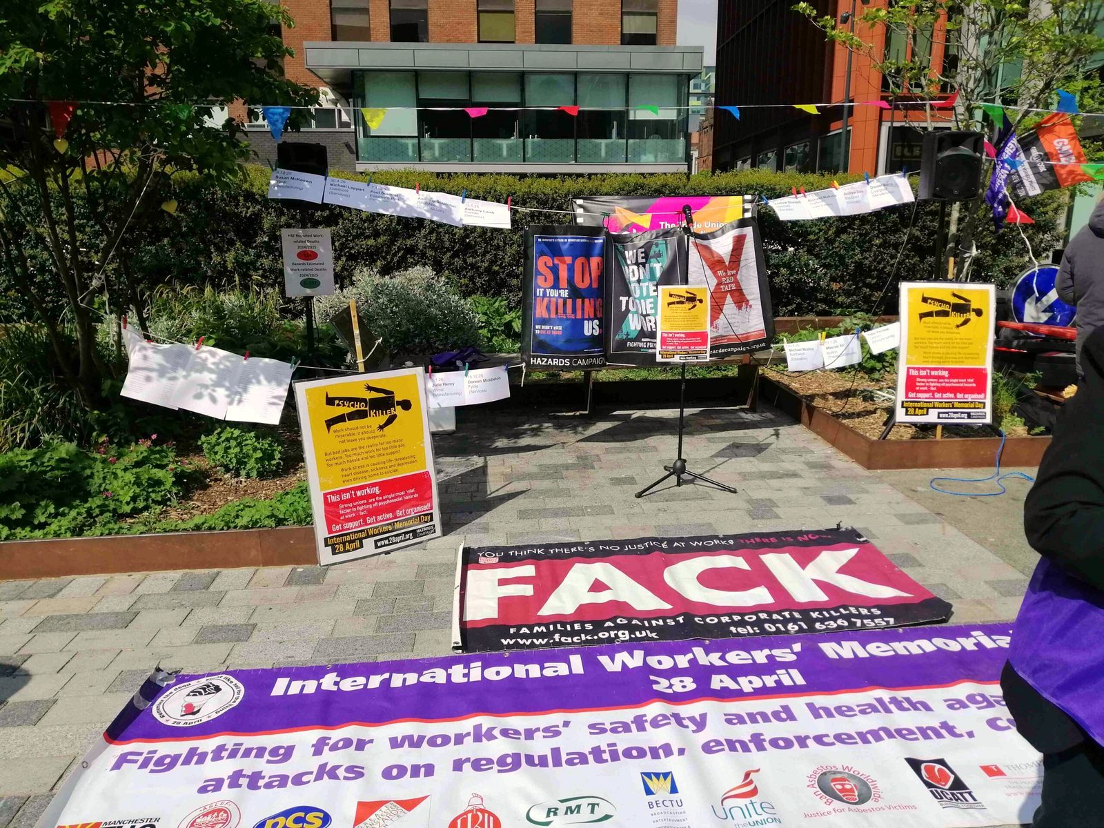 Banners and placards at the International Workers’ Memorial Day event in Manchester